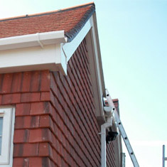 A photo showing the roof of a terraced house"